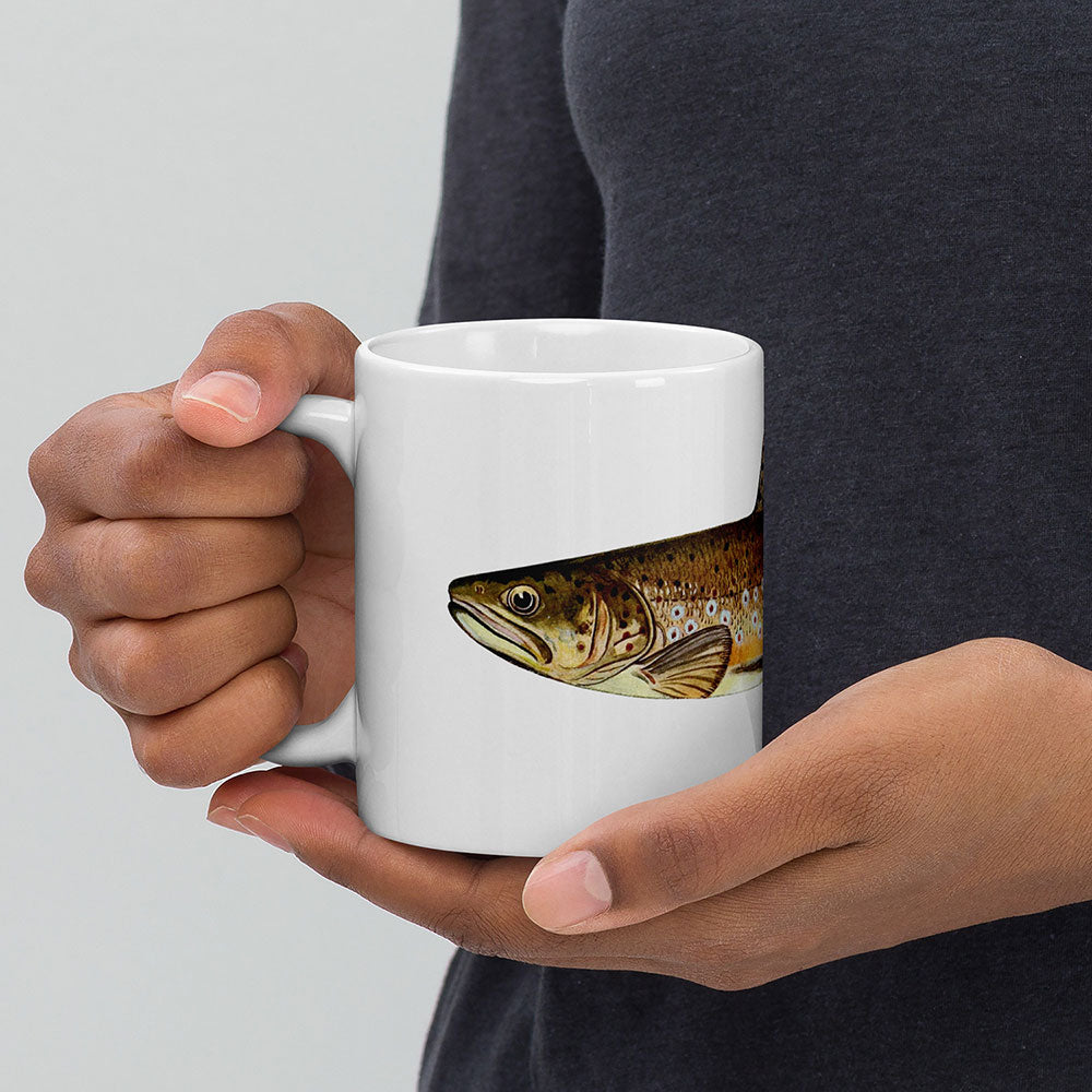 brown trout coffee mug in hand