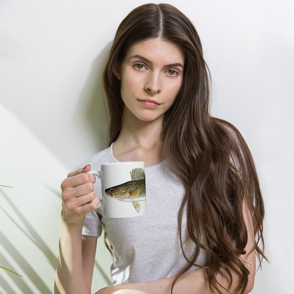 woman holding a coffee mug with a walleye design on it